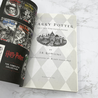 Harry Potter and the Sorcerer's Stone by J.K. Rowling [20th ANNIVERSAY TRADE PAPERBACK] • Scholastic