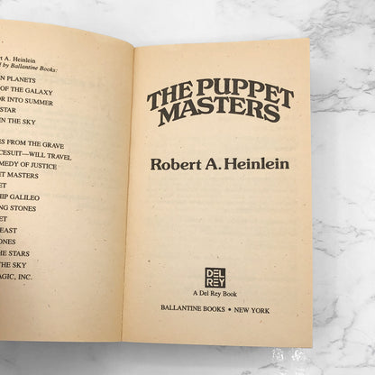 The Puppet Masters by Robert A. Heinlein [FIRST REVISED + UNCUT PRINTING] 1990 • Del-Rey