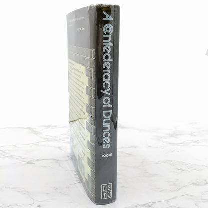 A Confederacy of Dunces by John Kennedy Toole [FIRST EDITION] 1980 • Louisiana State University • 13th Printing / 1994