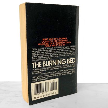 Back cover of a book titled 'The Burning Bed' with text and a barcode on a white background