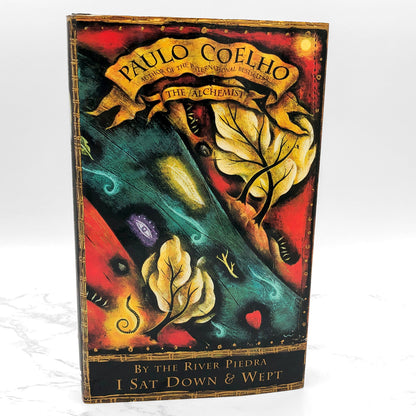 By the River Piedra I Sat Down and Wept by Paulo Coelho [U.S. FIRST EDITION] 1996 • Harper Collins