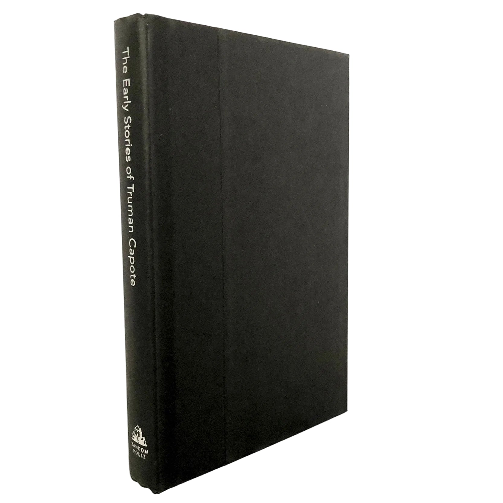 A black hardcover book standing upright on a light marble surface against a white background. The spine is visible and reads 'The Early Stories of Truman Capote' with a small publisher logo near the bottom.