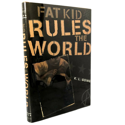 A hardcover book titled 'Fat Kid Rules the World' by K. L. Going, standing upright against a white background.
