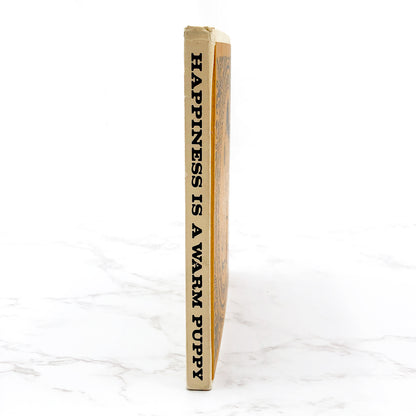 Happiness Is a Warm Puppy by Charles M. Schulz [FIRST EDITION • FIRST PRINTING] 1962 • Hardcover • Determined Productions