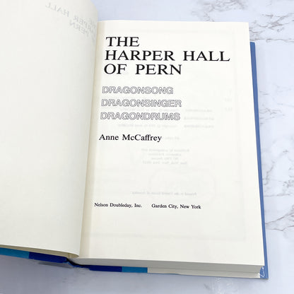 The Harper Hall of of Pern Trilogy (Dragonsong, Dragonsinger, Dragondrums) by Anne McCaffrey [FIRST EDITION OMNIBUS] BCE • 1984 • Doubleday