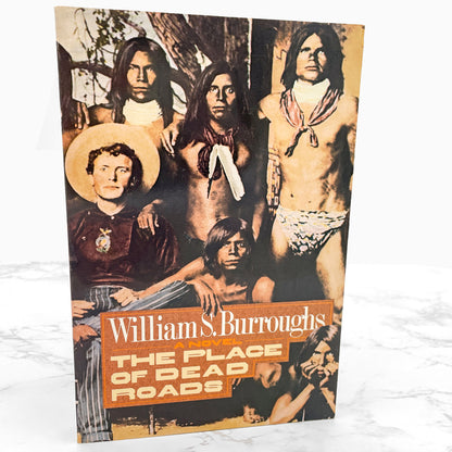 The Place of Dead Roads by William S. Burroughs [FIRST PAPERBACK EDITION] 1985 • Holt Rinehart Winston