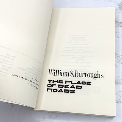 The Place of Dead Roads by William S. Burroughs [FIRST PAPERBACK EDITION] 1985 • Holt Rinehart Winston