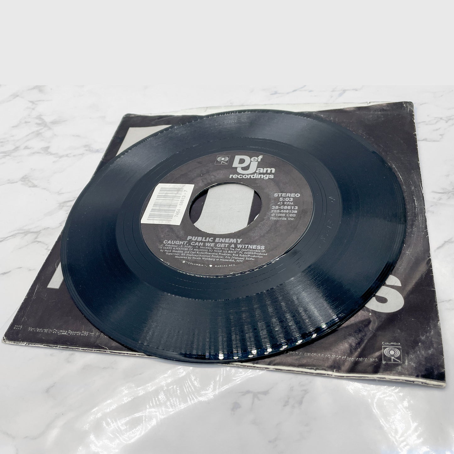 Public Enemy – Black Steel In The Hour Of Chaos b/w Caught Can I Get a Witness [7" VINYL SINGLE] 1988 • Def Jam