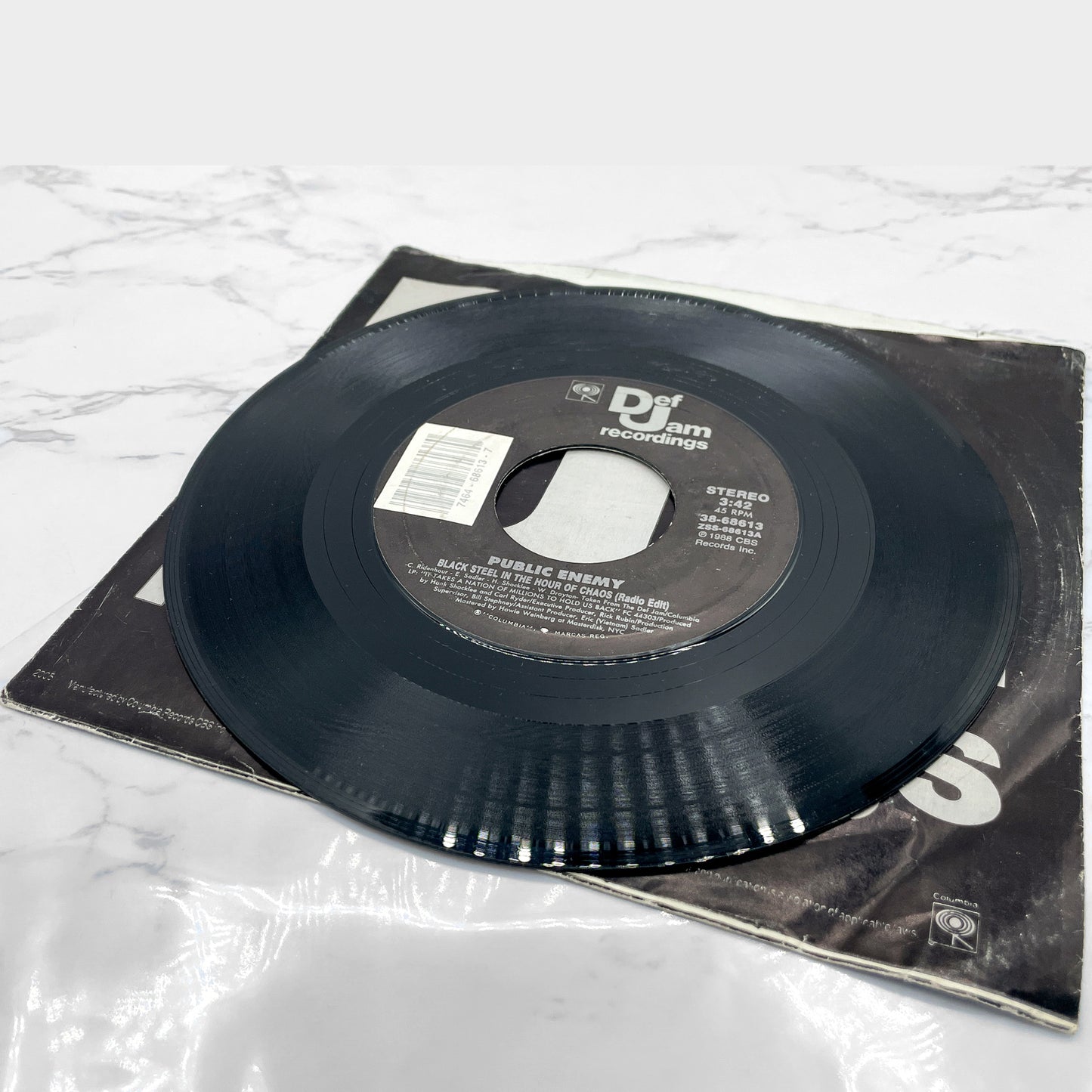 Public Enemy – Black Steel In The Hour Of Chaos b/w Caught Can I Get a Witness [7" VINYL SINGLE] 1988 • Def Jam