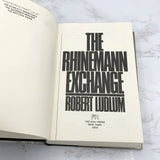 The Rhinemann Exchange by Robert Ludlum [FIRST EDITION • FIRST PRINTING] 1974 • The Dial Press