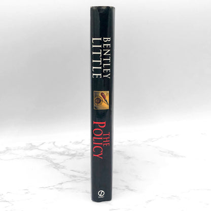 The Policy by Bentley Little [FIRST HARDCOVER EDITION] 2003 • Signet