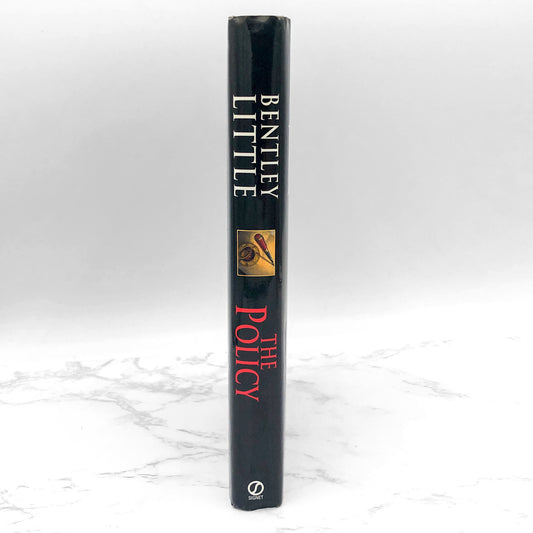 The Policy by Bentley Little [FIRST HARDCOVER EDITION] 2003 • Signet