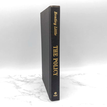 The Policy by Bentley Little [FIRST HARDCOVER EDITION] 2003 • Signet