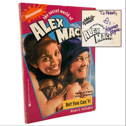 Book titled 'The Secret World of Alex Mack' with a cover featuring two characters and a smaller inset image.