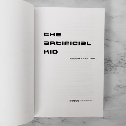 The Artificial Kid by Bruce Sterling [TRADE PAPERBACK] 1997 • Hardwired SF
