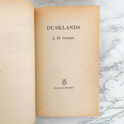 Dusklands by J.M. Coetzee [FIRST U.K. PAPERBACK PRINTING] 1983 • Penguin