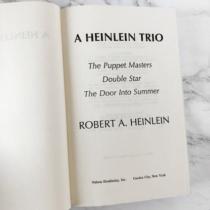 A Heinlein Trio: Three Novels by Robert A. Heinlein [FIRST BOOK CLUB EDITION / 1980]