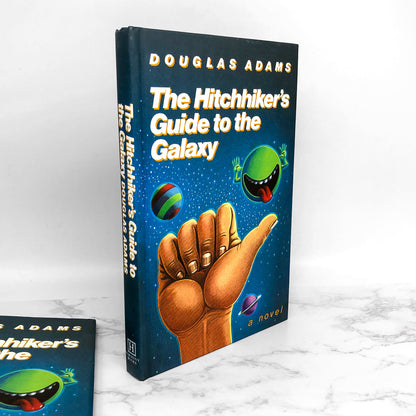 The Hitchhikers Guide to the Galaxy by Douglas Adams [25th ANNIVERSARY FACSIMILE HARDCOVER]