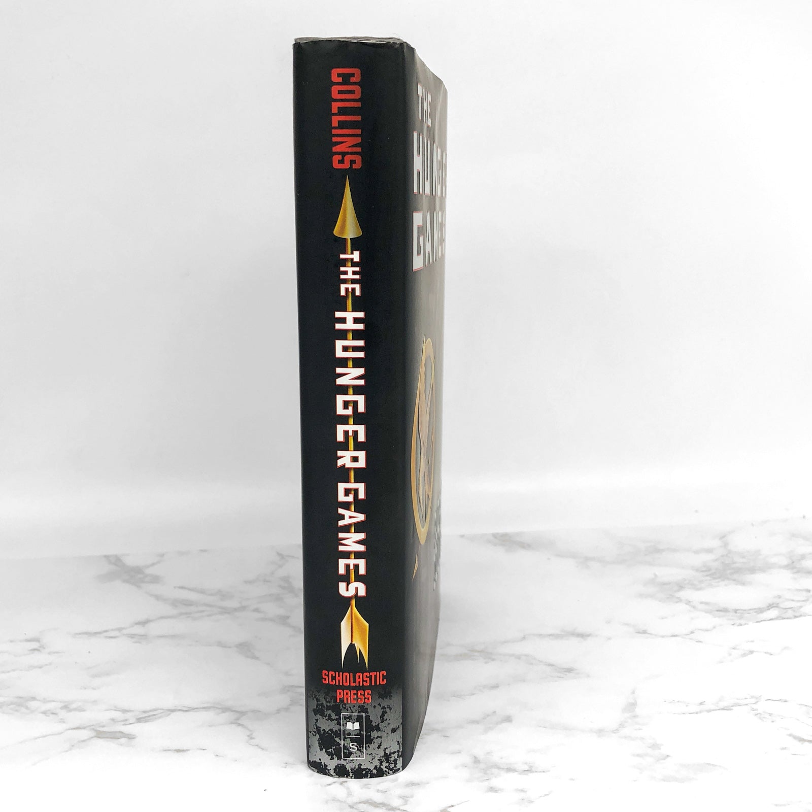 The Hunger Games. By Suzanne Collins. First Edition, First Printing.  Scholastic. New York, 2008.