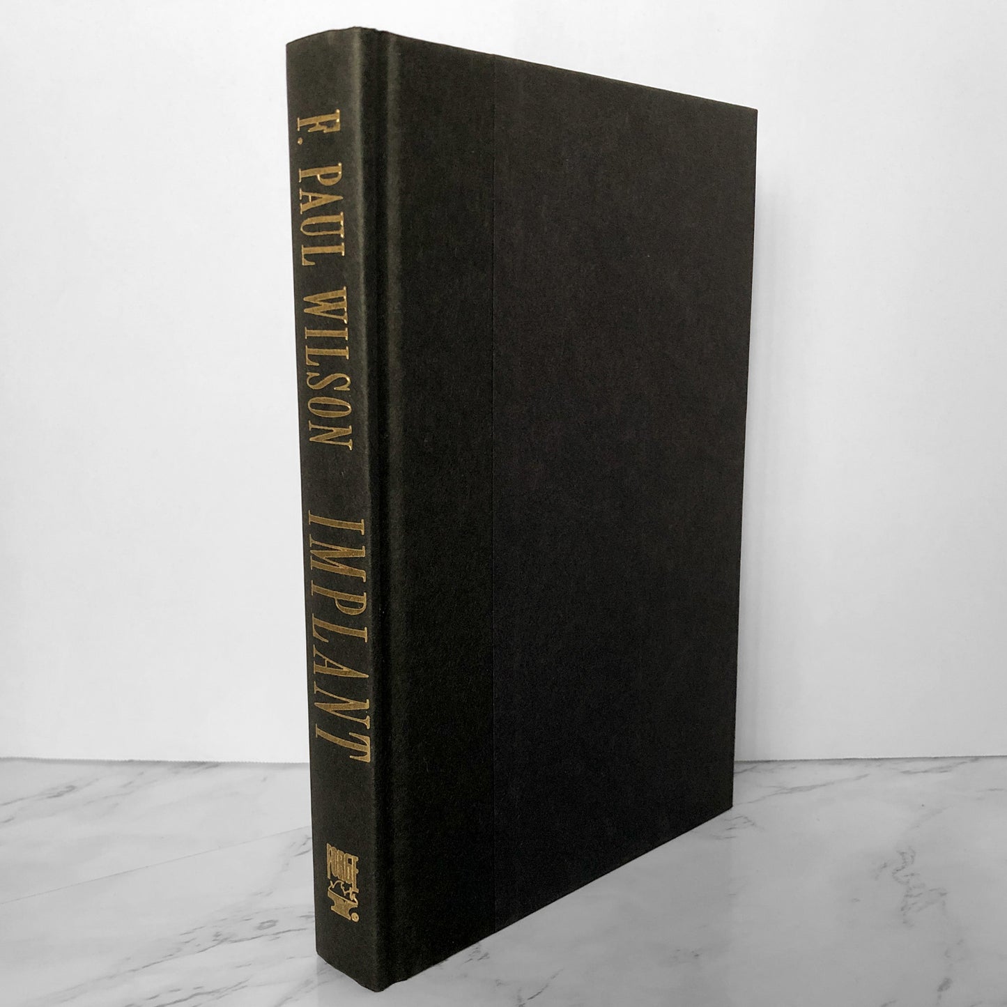 Implant by F. Paul Wilson [FIRST BC EDITION] - Bookshop Apocalypse
