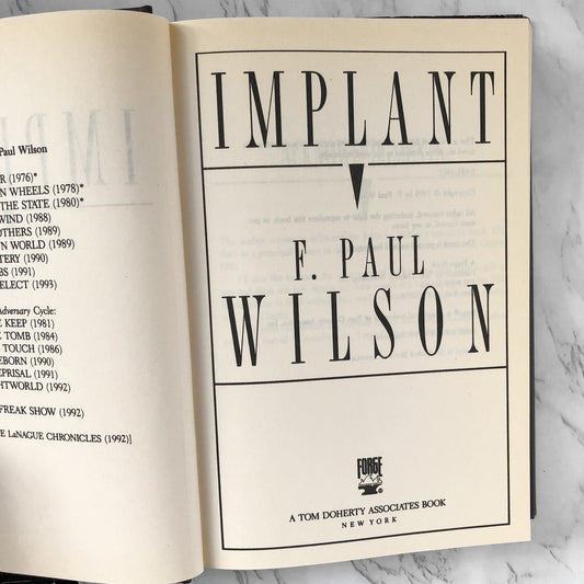 Implant by F. Paul Wilson [FIRST BC EDITION] - Bookshop Apocalypse
