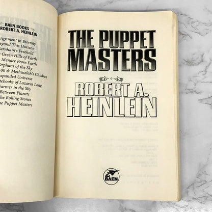The Puppet Masters by Robert A. Heinlein [TRADE PAPERBACK RE-ISSUE] 2009 • BAEN