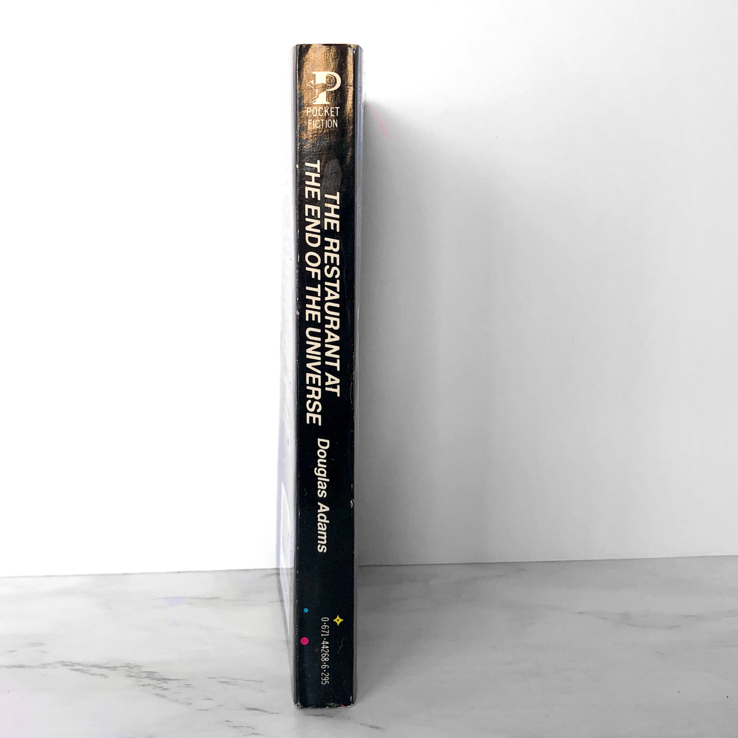 The Restaurant at the End of the Universe by Douglas Adams [FIRST PAPERBACK PRINTING / 1982]