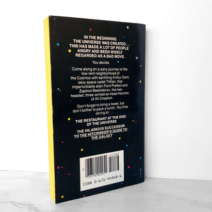 The Restaurant at the End of the Universe by Douglas Adams [FIRST PAPERBACK PRINTING / 1982]