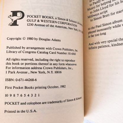 The Restaurant at the End of the Universe by Douglas Adams [FIRST PAPERBACK PRINTING / 1982]