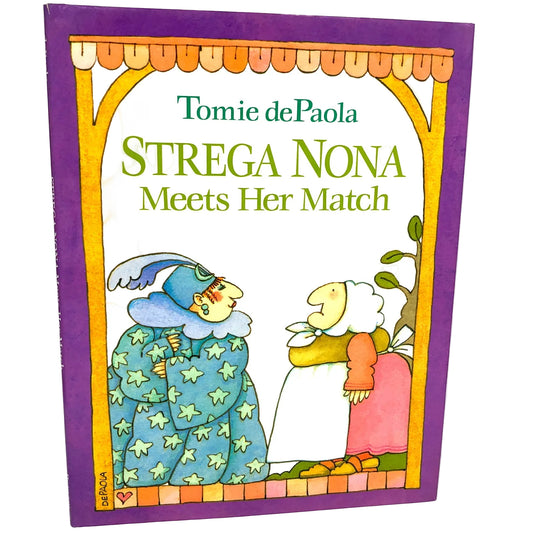 Cover of the children's picture book 'Strega Nona Meets Her Match' by Tomie dePaola, featuring illustrations of the main characters Strega Nona and Strega Amelia with a magical theme.